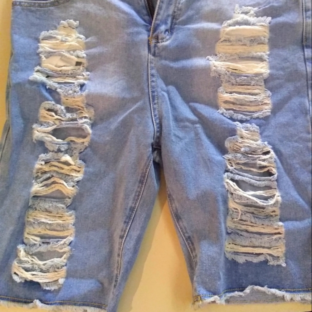 Men's torn distressed blue jean shorts